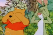 Rabbit closing his eyes with Pooh