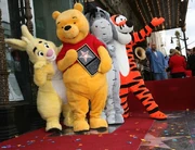 Rabbit with Tigger and Eeyore celebrating Pooh's star