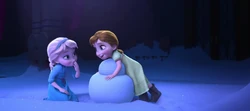 Young Anna and Elsa enjoying themselves in Elsa's snowy wonderland.