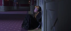 Anna mourning the loss of her parents outside Elsa's bedroom.