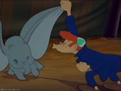 Smitty blowing on one of Dumbo's ears
