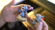 Yoda's prototype model next to Stitch's figure.