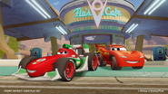 Lightning McQueen and Francesco in front of the café.