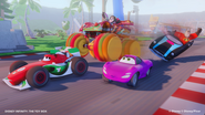 Vanellope racing in the kart, which has Monster Truck Wheels.