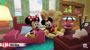 The window behind Mickey Mouse and Minnie Mouse.