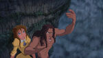 Jane watches as Tarzan speaks to the baboon