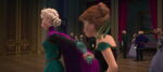 Elsa's glove being removed by Anna.