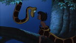 Mowgli being hypnotized by Kaa.