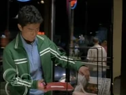 Simon slipping the playbook in the newspaper racket