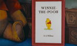 Winnie the Pooh is on the cover of his book