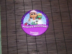 Button reading "Honorary VoluntEAR!" given to guests redeeming their free admission