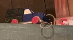 Mickey's House and Meet Mickey On top of a support beam just before the doors open to the Theater. Designed as a wooden pull toy, with the rocket as the drawstring.