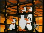 A bunch of penguins who look like the waiters in "Save the Whale"