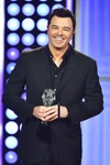 Seth MacFarlane receiving his Critics' Choice Louis XIII Genius Award onstage during the 5th Annual Critics' Choice Television Awards in May 2015.