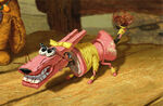 With a head made from a clothespin, Angel’s dog bares his painted-on teeth