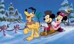 Mickey and minnie sledding with pluto