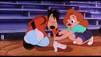 Roxanne helps Max up after he falls off the bleachers.