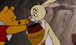 Winnie the Pooh is about to take Rabbit's honey pot