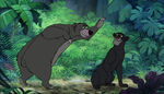 Baloo about to hug Bagheera