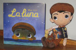 A plush of the main character and the book