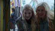 Ingrid and a young Emma bonding over an arcade game