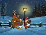 Goofy, Donald, and Minnie singing Christmas carols outside of Mickey's house (Pluto's Christmas Tree)