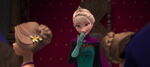 Elsa giggles as the Duke takes Anna away for a dance.