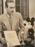 Walt with a Mickey plush.