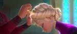 The tiara being fitted in place on Elsa's head