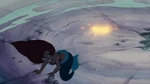 Ariel barely misses being hit by Ursula's blasts