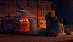 Red watering his flowers around the statue in Mater and the Ghostlight