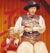 Wally Boag as "Pecos Bill" at the Golden Horseshoe Revue in the early 1970s. Betty Taylor as "Slue Foot Sue" in the background.