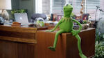 Kermit sitting on his desk
