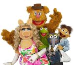 A group photo of Kermit the Frog, Miss Piggy, Fozzie Bear, Gonzo, and Walter