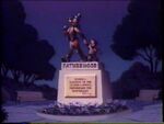 Goofy and son on fatherhood monument