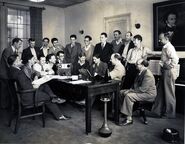 1931; Standing from left: Smith, Seward, Englander, Zamora, Hand, Palmer, Cutting, W. Disney, Churchill, Cannon, Sharpsteen Seated from left: King, Lundy, Sears, Ferguson, de Tremaudan, Jackson, Clark, Gillett, Lewis.