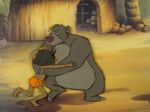 Rare production cel of Baloo grabing Mowgli.