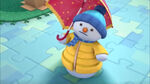 Chilly in his snowclothes with an umbrella