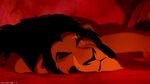 Scar lands on the ground after being thrown off the edge by Simba
