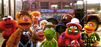 The gang in front of the bus inside The Muppet Movie's ghost town.