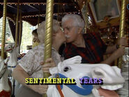 Gerry Lock and Kort Falkenberg giving a kiss on a Carousel ride.