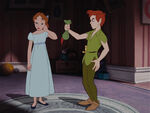 Wendy with Peter and Tinker Bell (who is in Peter's cap)