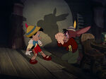 Lampwick pleads with Pinocchio to help him.