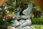 A qilin, phoenix, and carp forming into three statues in one in Garden of Wonders at Mystic Point