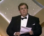 John Candy speaks at the 60th annual Academy Awards in February 1988.