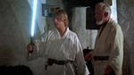 Luke Skywalker activates his father's lightsaber for the first time.