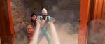 Frozone protects the Parr kids from the hypnotized wannabe supers.