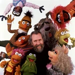 Miss Piggy with Jim Henson, Kermit, Gonzo, Animal, and several other of Henson's famous puppets.