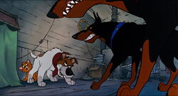 Dodger protecting Oliver from Roscoe and Desoto.