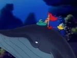 Ariel, Sebastian, and Flounder riding a whale